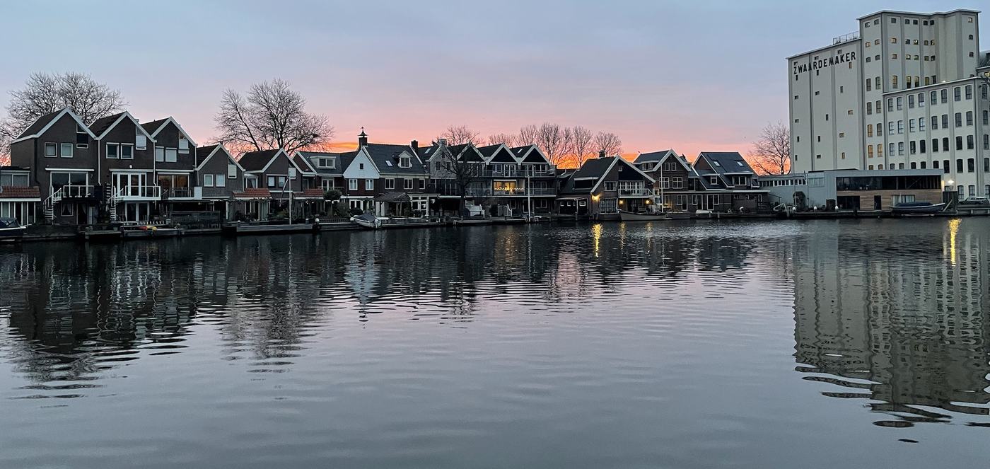Waterfront houses and the Zwaardemaker building at sunset